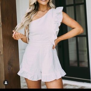 NEW WITH TAGS. White One Shoulder Romper with Ruffle